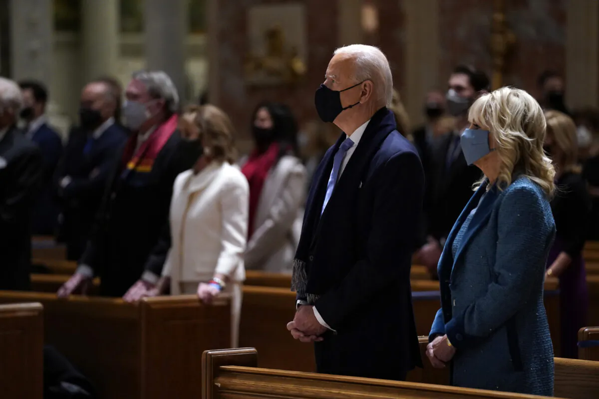 President-elect Joe Biden is joined his wife Jill Biden as they celebrate Mass at the Cathedral of St. Matthew the Apostle on Inauguration Day in Washington on Jan. 20, 2021. (Evan Vucci/AP Photo)
