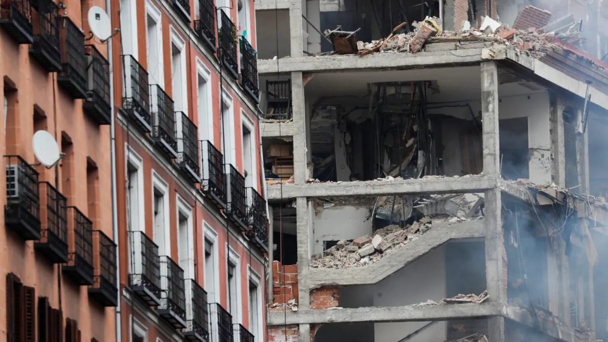 Smoke rises from a damaged building after an explosion in Madrid on Jan. 20, 2021. (Susana Vera/Reuters)