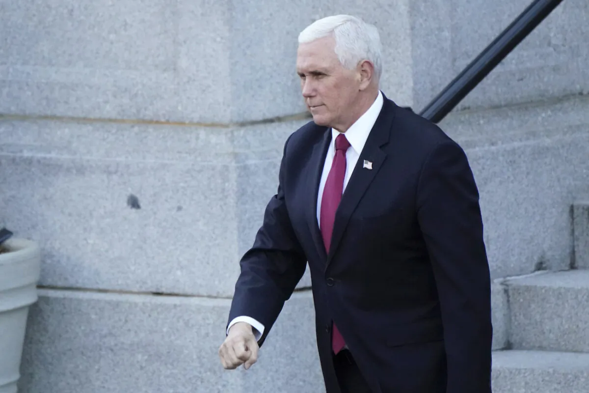 Then-Vice President Mike Pence walks to the West Wing of the White House after addressing staff on the steps of the Eisenhower Executive Office Building, in the White House complex on Jan. 19, 2021. (Gerald Herbert/AP Photo)