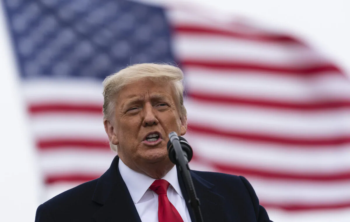 President Donald Trump speaks near a section of the U.S.-Mexico border wall in Alamo, Texas, on Jan. 12, 2021. (Alex Brandon/AP Photo)