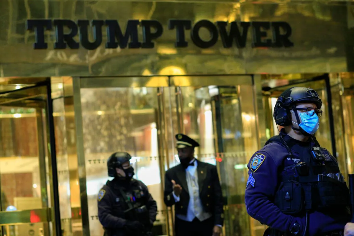 NYPD officers stand guard in front on Trump Tower on 5th Avenue the night before the presidential election, in New York, N.Y., on Nov. 2, 2020. (Kena BetancurAFP via Getty Images)