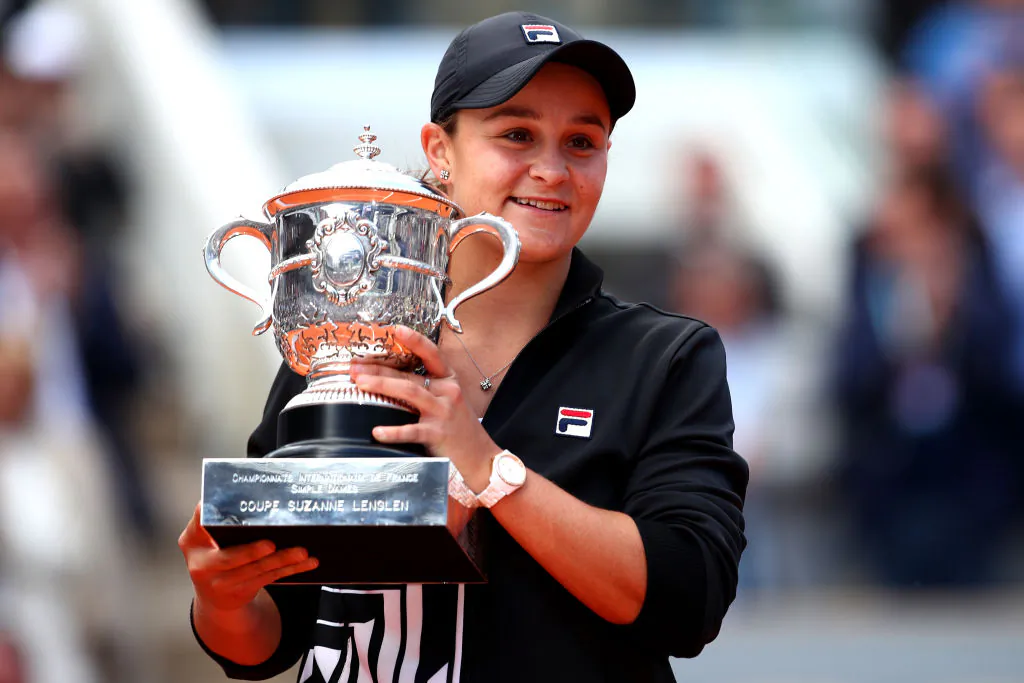 Ashleigh Barty of Australia celebrates victory with the trophy following the ladies singles final against Marketa Vondrousova of The Czech Republic during Day fourteen of the 2019 French Open at Roland Garros on June 08, 2019 in Paris, France. (Photo by Clive Brunskill/Getty Images)