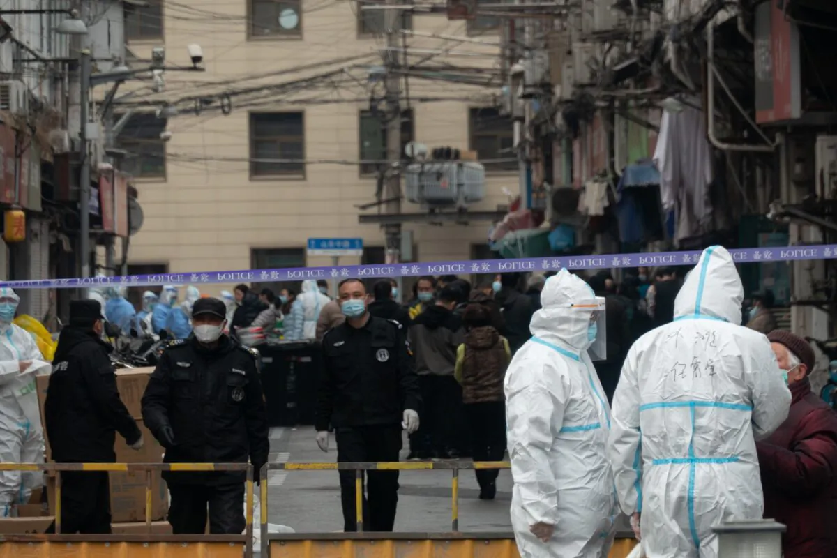 Police cordon off an area around a residential neighborhood in Huangpu district of Shanghai, on Jan. 21, 2021. (STR/AFP via Getty Images)