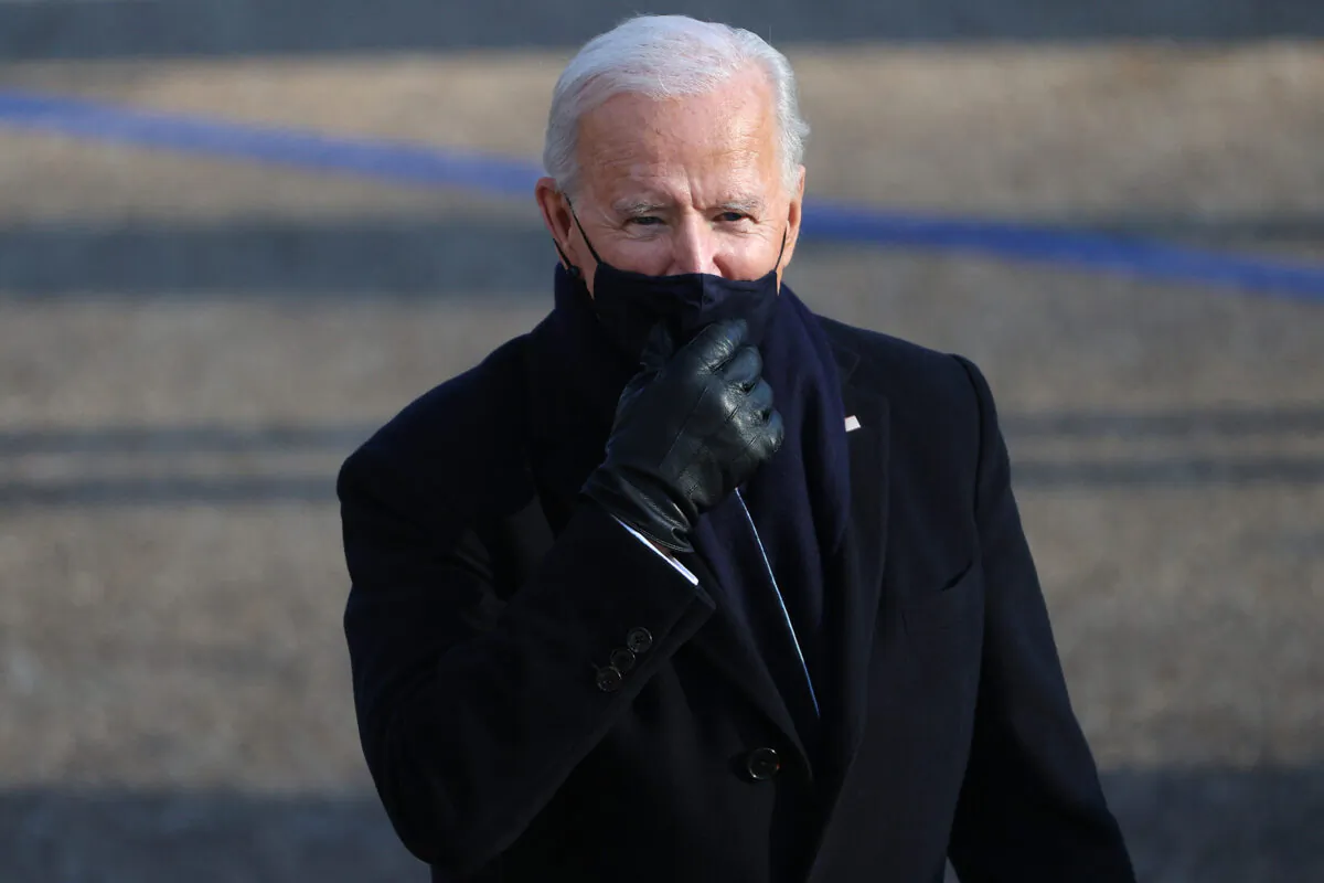 President Joe Biden walks the abbreviated parade route after Biden's inauguration in Washington on Jan. 20, 2021. (Patrick Smith/Getty Images)