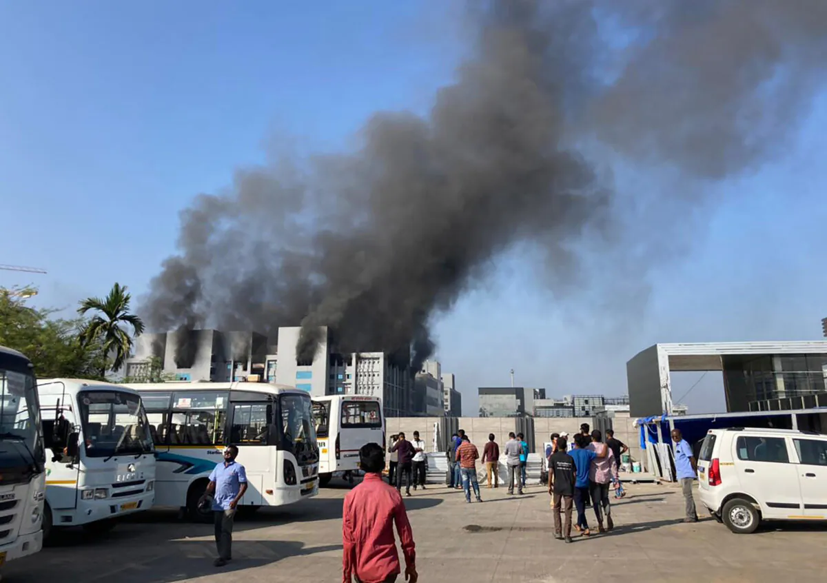 Smoke rises from the Serum Institute of India, the world's largest vaccine maker that is manufacturing the AstraZeneca/Oxford University vaccine for the CCP virus, in Pune, India, on Jan. 21, 2021. (Rafiq Maqbool/AP Photo)