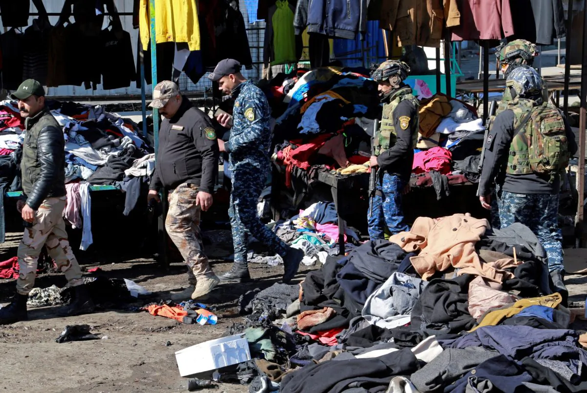 Security forces work at the site of a deadly bomb attack in Baghdad, Iraq, on Jan. 21, 2021. (Hadi Mizban/AP Photo)