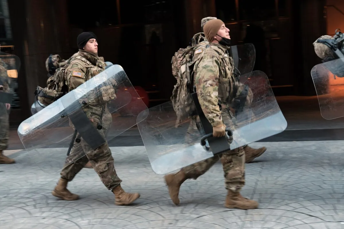 Members of the National Guard walk through the streets of Washington on Jan. 20, 2021. (Spencer Platt/Getty Images)