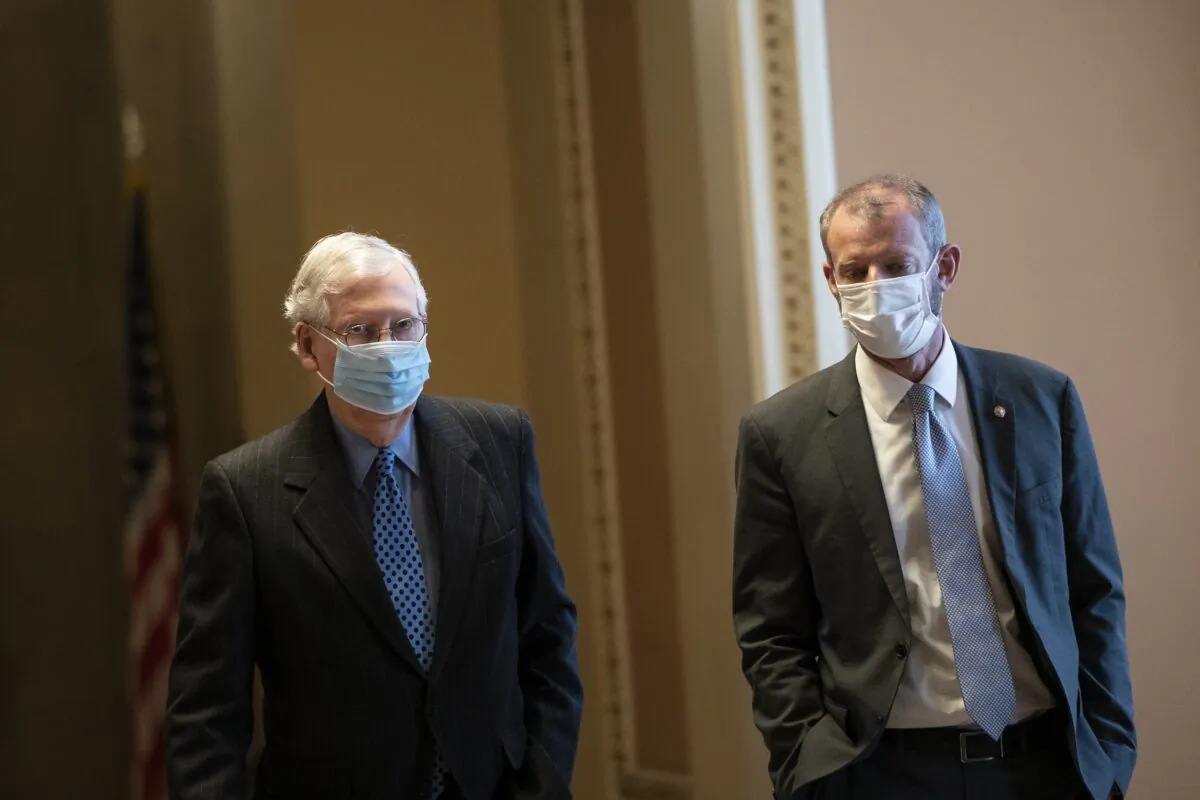 Senate Minority Leader Mitch McConnell (R-Ky.) walks in the U.S. Capitol in Washington on Jan. 21, 2021. (Drew Angerer/Getty Images)