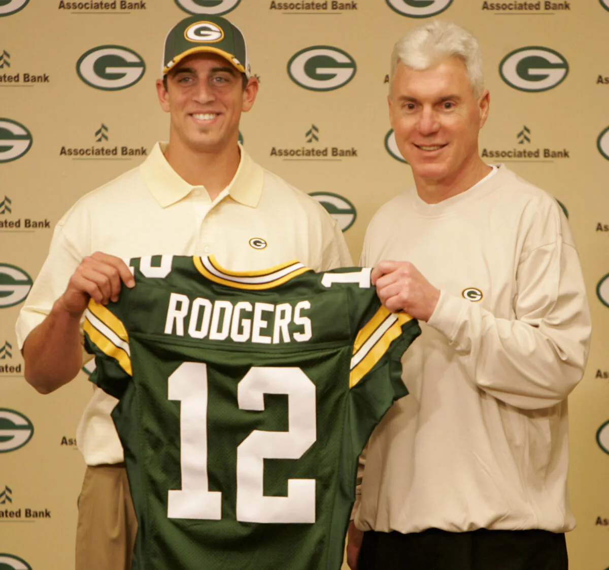 Green Bay Packers general manager Ted Thompson stands next to the team's first-round pick, California quarterback Aaron Rodgers, during an NFL football a news conference in Green Bay, Wis., on April 24, 2005. (Mike Roemer/AP Photo)
