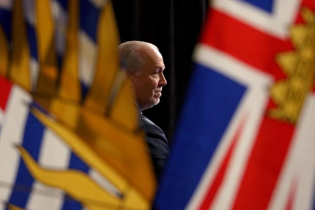 Premier John Horgan attends a press conference in the rotunda at Legislature in Victoria, B.C., on May 6, 2020. (Chad Hipolito/The Canadian Press)