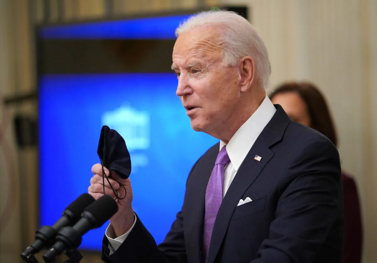 President Joe Biden speaks about the CCP virus response before signing executive orders in the State Dining Room of the White House in Washington on Jan. 21, 2021. (Mandel Ngan/AFP via Getty Images)