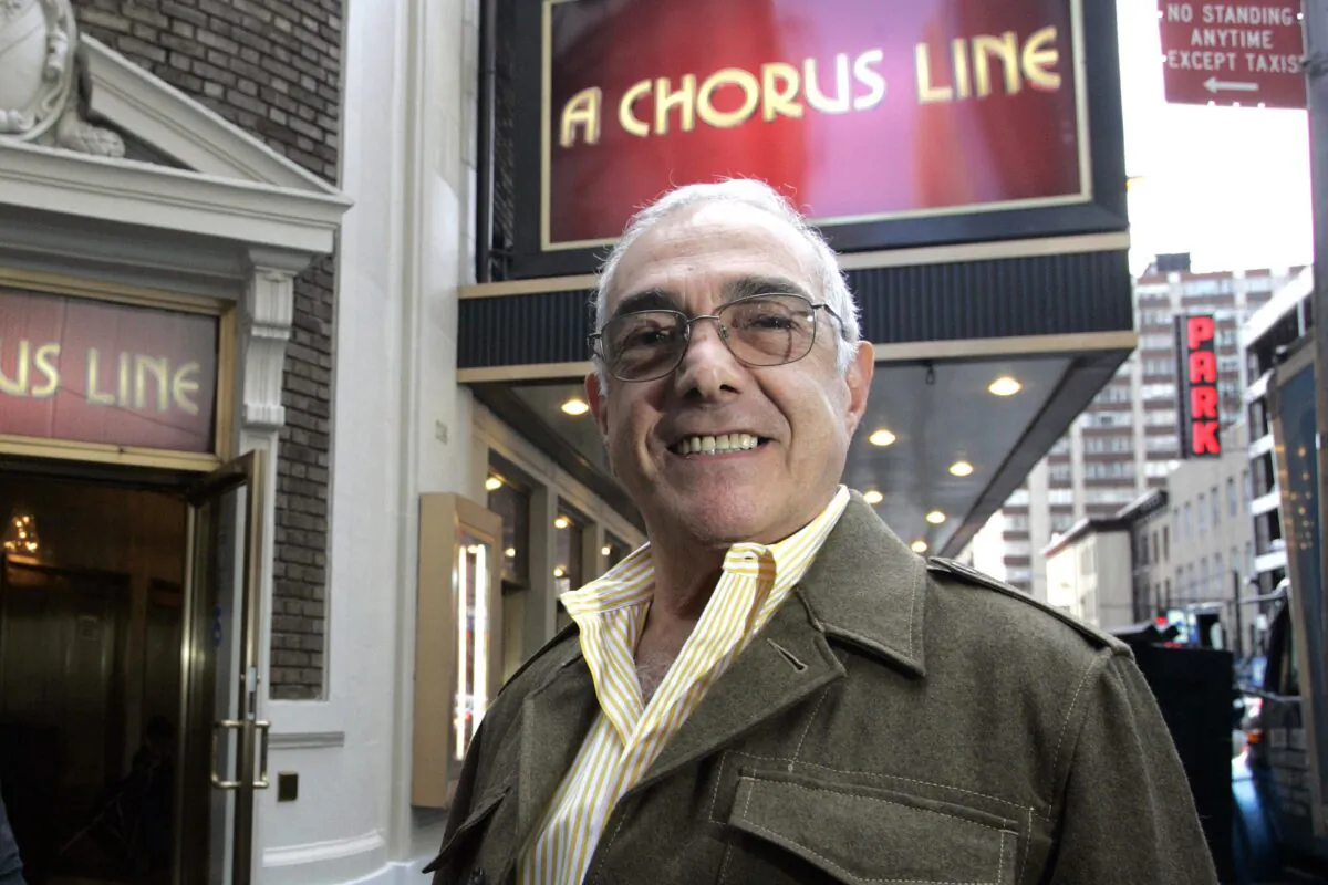 Tony Award-winning choreographer Bob Avian poses in front of the Gerald Schoenfeld Theatre, home of the revival of "A Chorus Line," in New York, in Sept. 29, 2006. (Shiho Fukada/AP Photo, File)