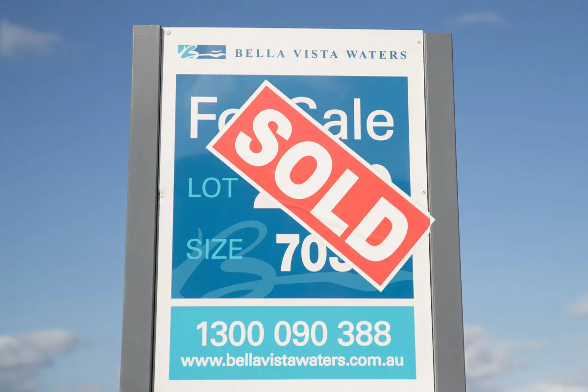 A sold sticker is seen over a for sale sign on an empty development plot in the new development of Bella Vista Waters in Sydney, Australia on Feb. 25, 2019. (Mark Kolbe/Getty Images)