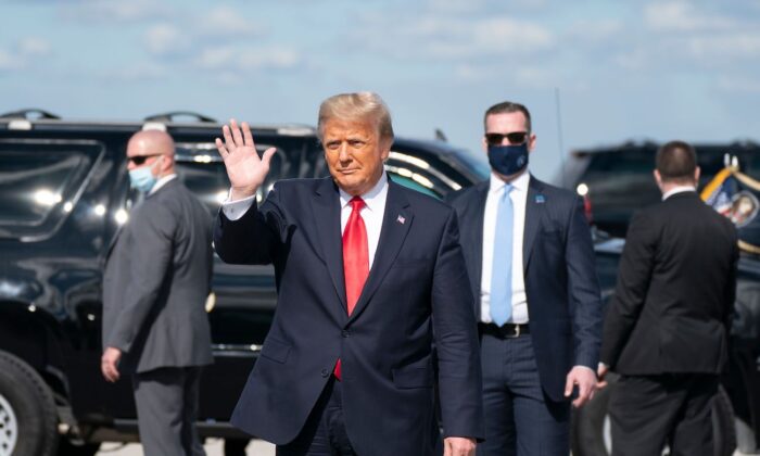 Outgoing President Donald Trump waves after landing at Palm Beach International Airport in West Palm Beach, Florida, on Jan. 20, 2021. (Alex Edelman/AFP via Getty Images)