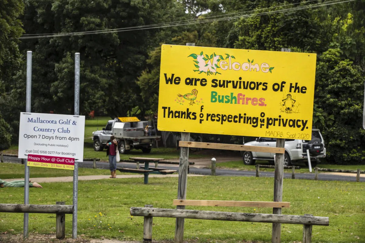 A sign reading "We are survivors of the bushfires" is shown at Maurice Avenue round about in Mallacoota, Australia on Dec. 31, 2020. (Diego Fedele/Getty Images)