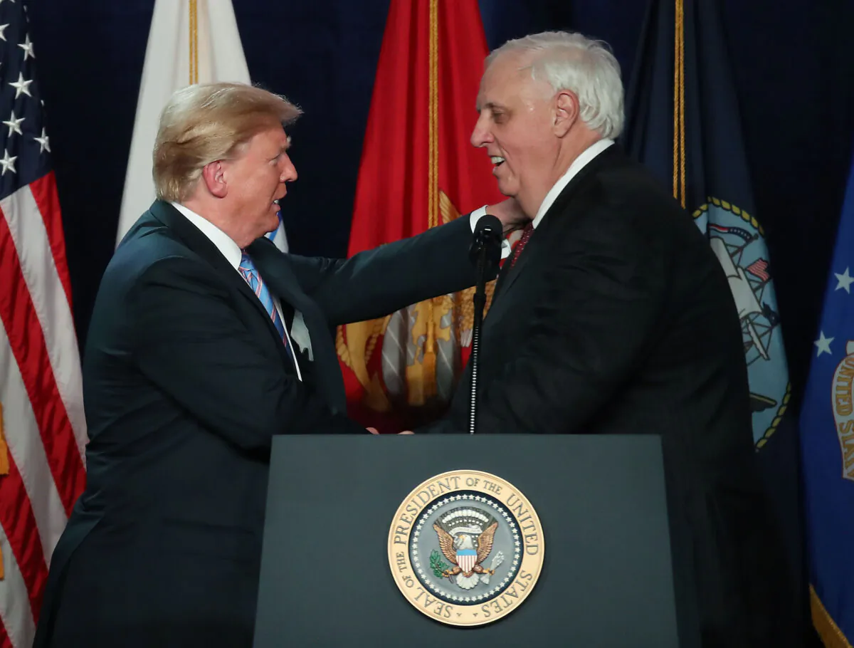 Then President Donald Trump is introduced at an event by West Virginia Gov. Jim Justice (R), in White Sulphur Springs, W.Va., on June 3, 2018. (Mark Wilson/Getty Images)