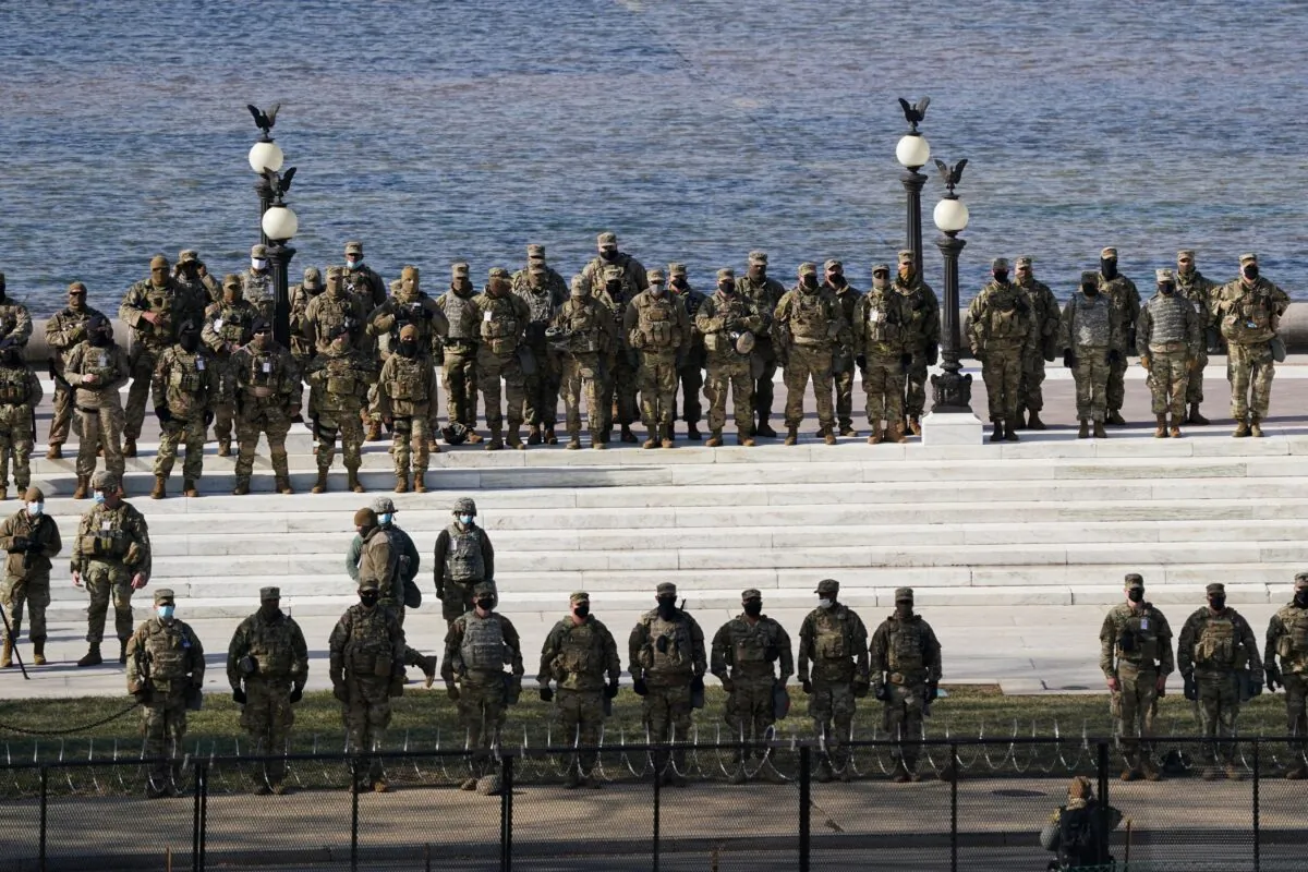 National Guard members stand during the 59th Presidential Inauguration near the U.S. Capitol in Washington on Jan. 20, 2021. (Erin Schaff/Pool via Reuters)