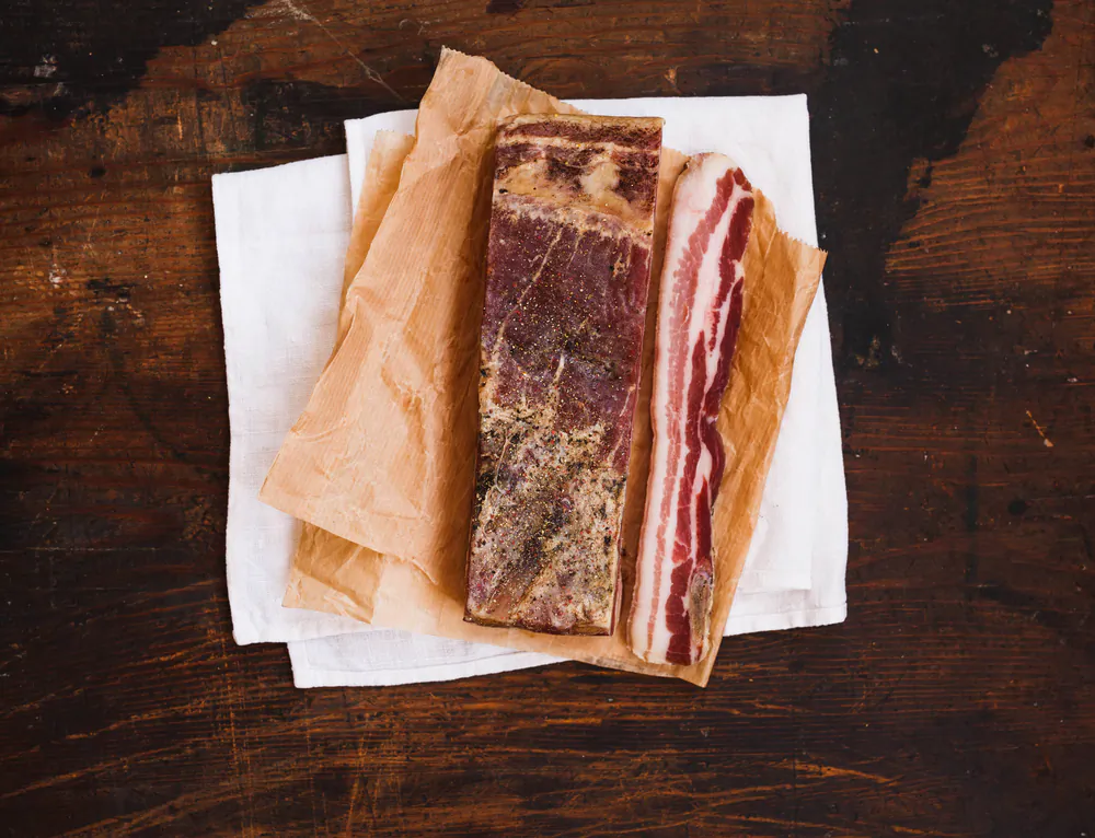 Making your own bacon is surprisingly simple; the hardest part is the waiting. (casanisa/Shutterstock)