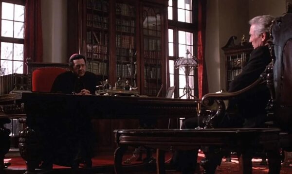 _Bishop talking with a man in his office