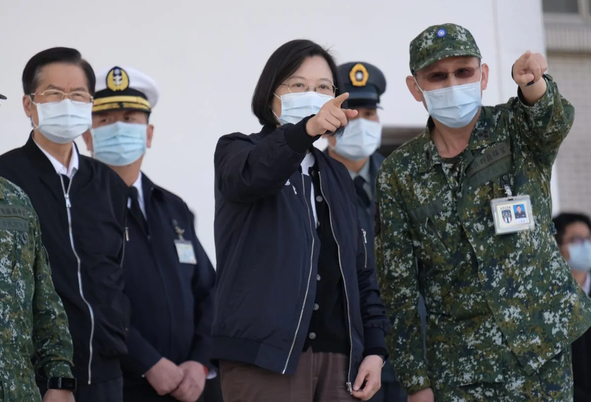 Taiwan's President Tsai Ing-wen (C) listens while inspecting military troops in Tainan, southern Taiwan, on Jan. 15, 2021. (Sam Yeh/AFP via Getty Images)