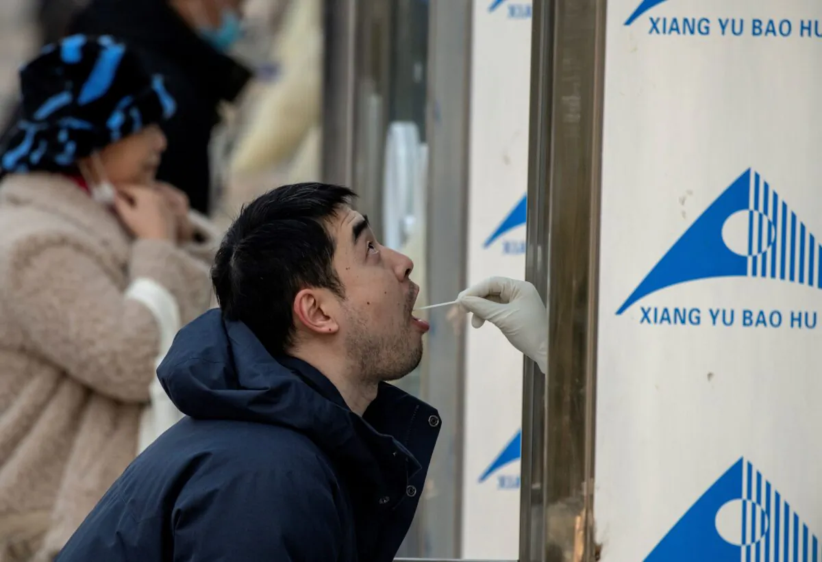 People are tested for COVID-19 in Beijing, on Jan. 23, 2021. (NOEL CELIS/AFP via Getty Images)