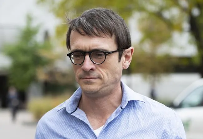 Cameron Ortis, a senior intelligence official at the RCMP, leaves the courthouse in Ottawa after being granted bail, on Oct. 22, 2019. New documents show Canada’s cyberspy agency was so alarmed by the potential fallout from an alleged secrecy breach by Ortis that it revised a damage assessment to “severe” from "high" in the days after his arrest. (Justin Tang/The Canadian Press)