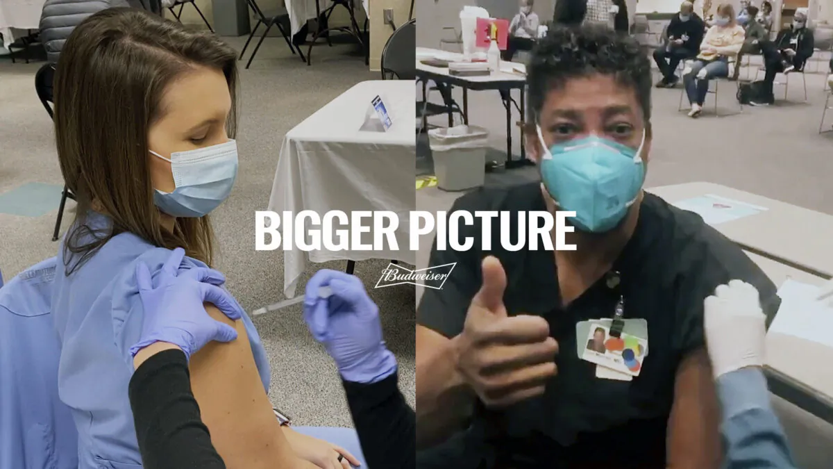 Two health care workers are getting vaccinated in an advertisement Budweiser is running before the Super Bowl. (Budweiser via AP)
