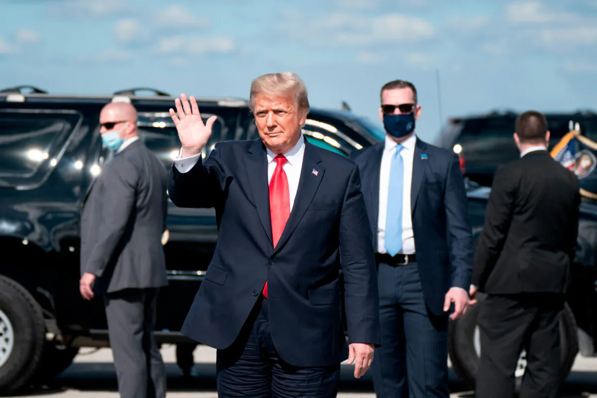 Outgoing President Donald Trump waves after landing at Palm Beach International Airport in West Palm Beach, Fla., on Jan. 20, 2021. (Alex Edelman/AFP via Getty Images)