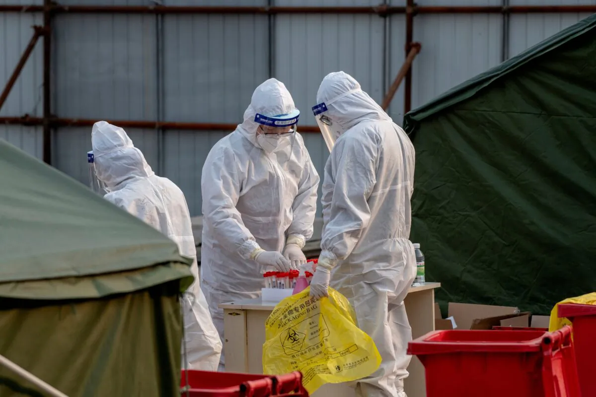 Medical workers are seen at a COVID-19 test site in Beijing, China, on Jan. 23, 2021. (Noel Celis/AFP via Getty Images)