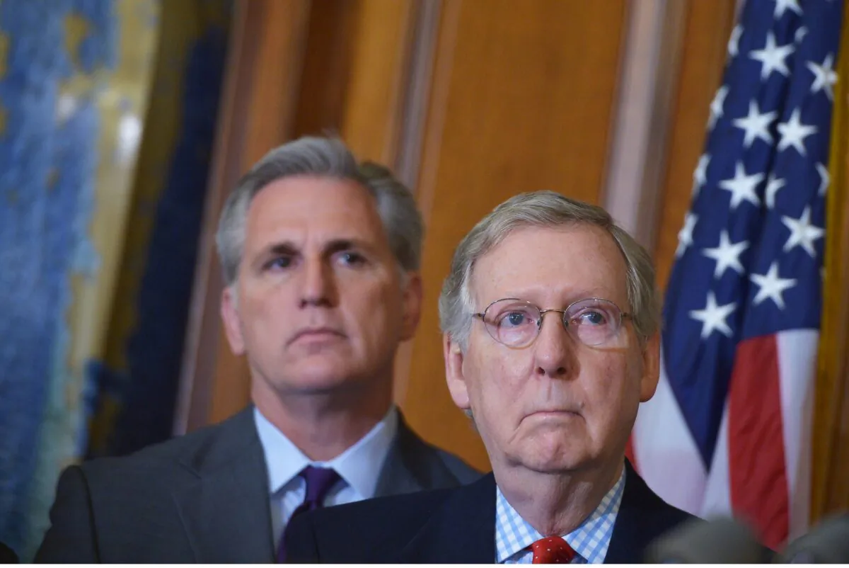 Then-Senate Majority Leader Mitch McConnell (R-Ky.) stands next to then-House Majority Leader Kevin McCarthy (R-Calif.) in the Rayburn Room of the U.S. Capitol in Washington on Feb. 13, 2015. (Mandel Ngan/file/AFP via Getty Images)