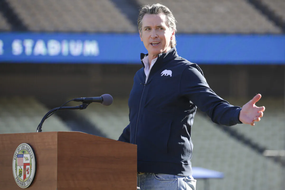 Gov. Gavin Newsom addresses a press conference at Dodger Stadium in Los Angeles on Jan. 15, 2021. (Irfan Khan/Los Angeles Times via AP, Pool)