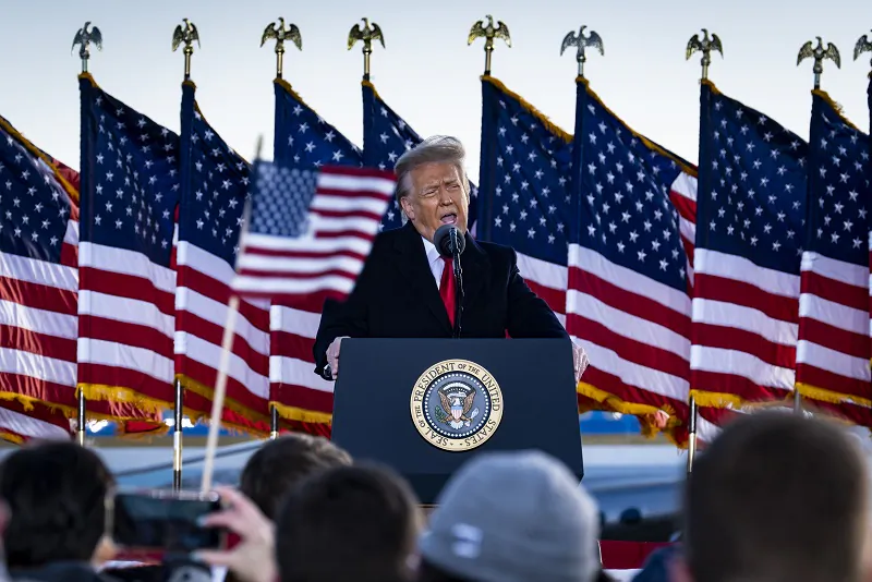 Then-President Donald Trump speaks to supporters at Joint Base Andrews before boarding Air Force One for his last time as President in Joint Base Andrews, Maryland on Jan. 20, 2021. (Pete Marovich - Pool/Getty Images)