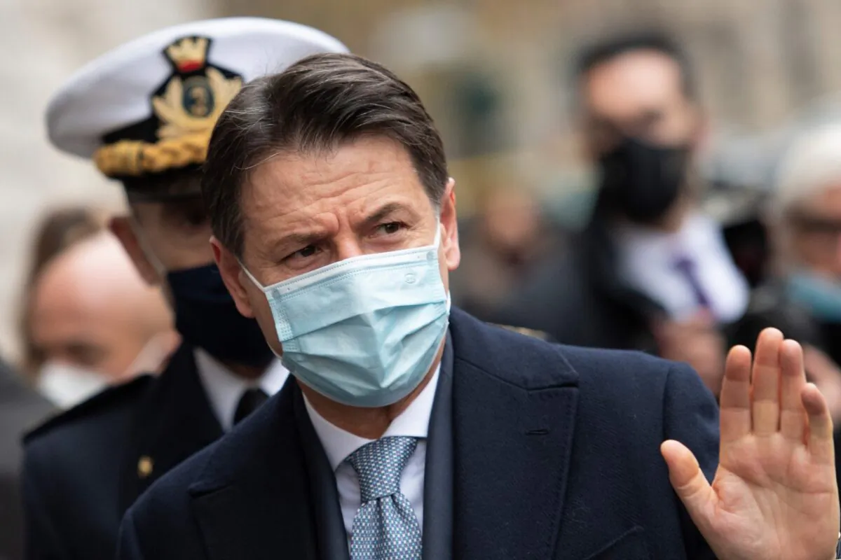 Italy's Prime Minister Giuseppe Conte waves as he arrives to take part in a ceremony to replace the Commander General of the Carabinieri Corps at the 'De Tommaso' barracks in Rome, on Jan. 15, 2021. (Alberto Pizzoli/AFP via Getty Images)