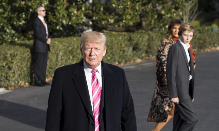 President Donald Trump talks to reporters before departing with his family from the White House to his Mar-a-Lago resort in Florida for the Thanksgiving holiday, in Washington on Nov. 21, 2017. (Samira Bouaou/The Epoch Times)