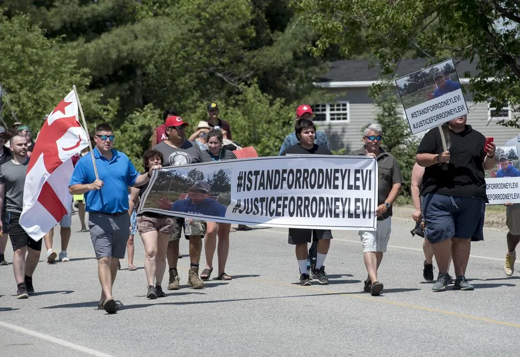 People walk to honour Rodney Levi in Red Bank, N.B., on June 19, 2020. New Brunswick's Public Prosecutions Service has concluded no charges will be filed against police officers involved in the fatal shooting of Rodney Levi last year. (Stephen MacGillivray/The Canadian Press)