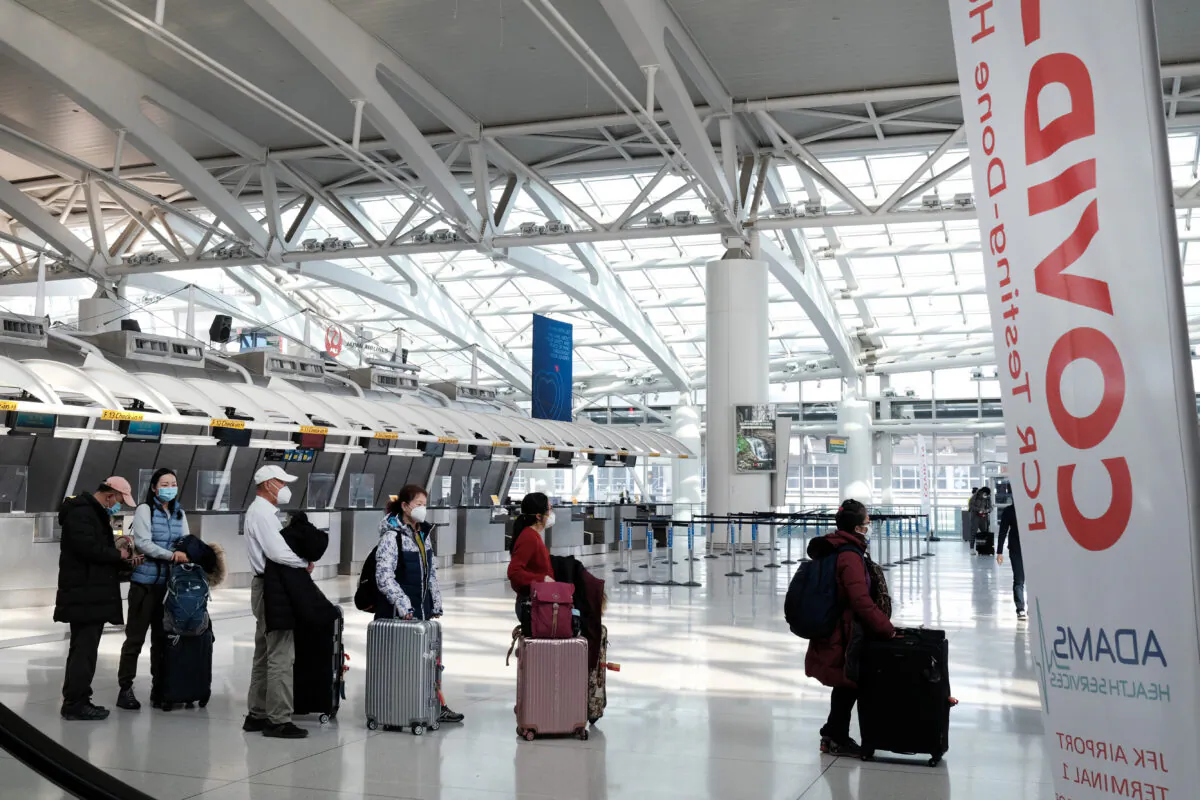 People wait for a flight at an international terminal at John F. Kennedy International Airport in New York City, on Jan. 25, 2021. (Spencer Platt/Getty Images)