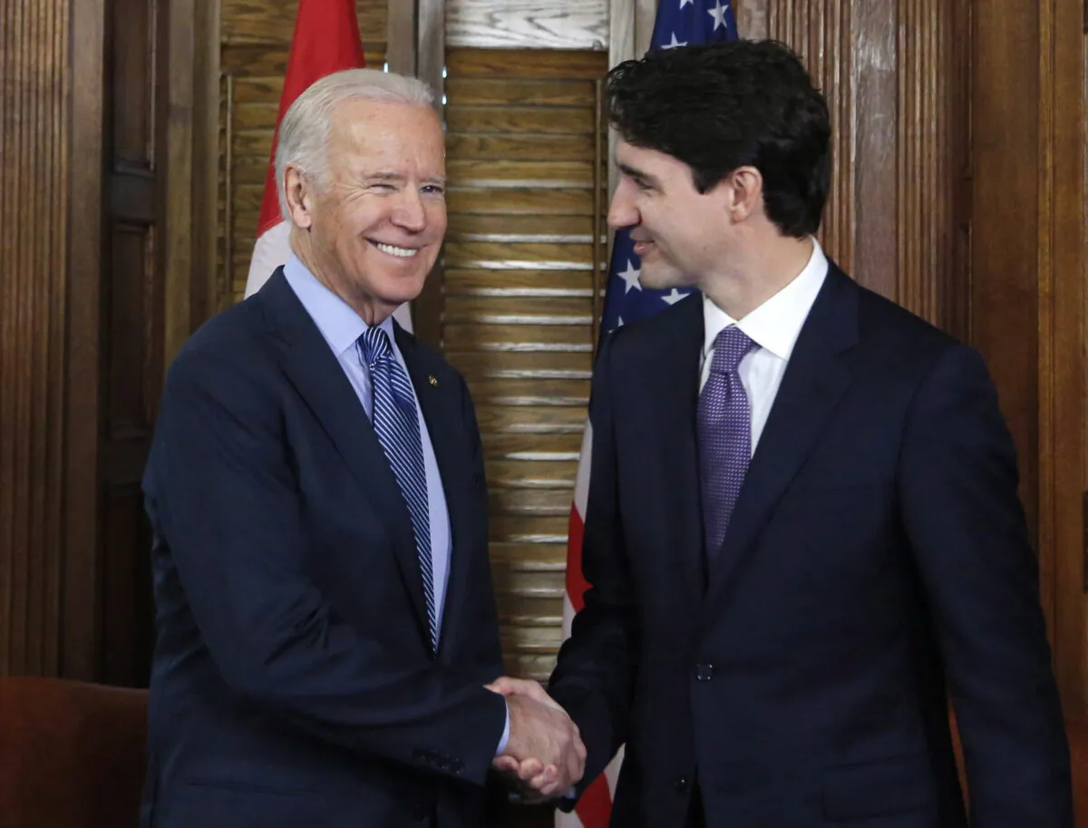 Canadian Prime Minister Justin Trudeau shakes hands with then U.S. Vice President Joe Biden on Parliament Hill in Ottawa on Dec. 9, 2016. (Patrick Doyle/The Canadian Press)