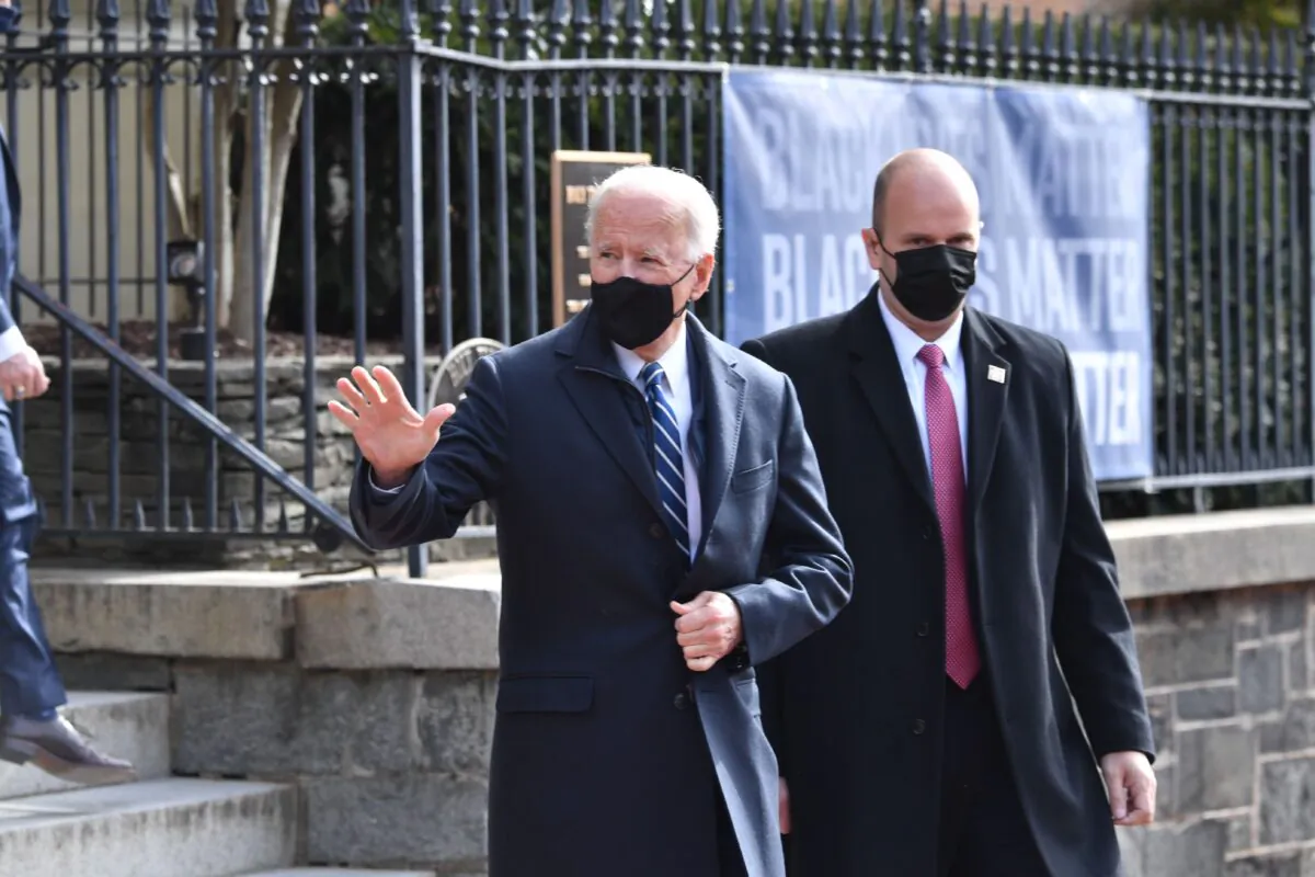 President Joe Biden(C) leaves Holy Trinity Catholic Church in the Georgetown neighborhood of Washington, DC on Jan. 24, 2021. (NICHOLAS KAMM/AFP via Getty Images)