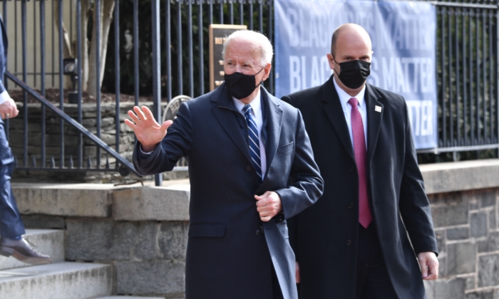 President Joe Biden (C) leaves Holy Trinity Catholic Church in the Georgetown neighborhood of Washington, on Jan. 24, 2021. (Nicholas Kamm/AFP via Getty Images)