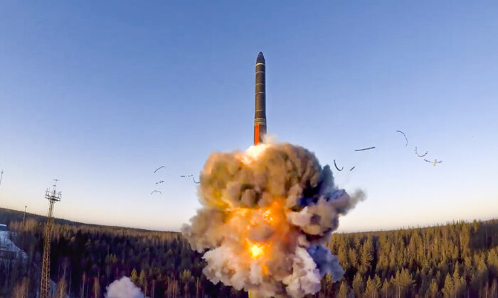 A rocket launches from missile system as part of a ground-based intercontinental ballistic missile test launched from the Plesetsk facility in northwestern Russia on Dec. 9, 2020. (Russian Defense Ministry Press Service via AP)