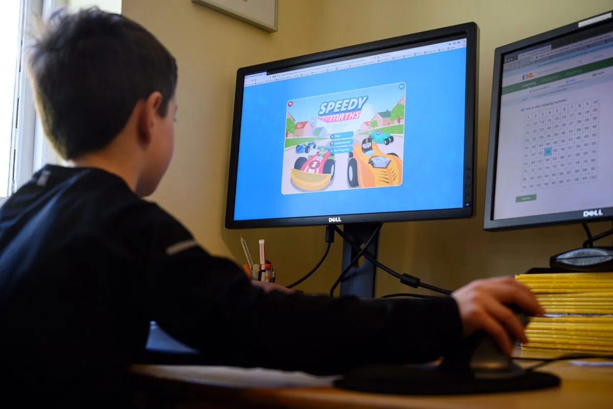 A 6 year old boy learns online during lockdown in the village of Marsden, near Huddersfield, northern England, on March 23, 2020. (Oli Scarff/AFP via Getty Images)