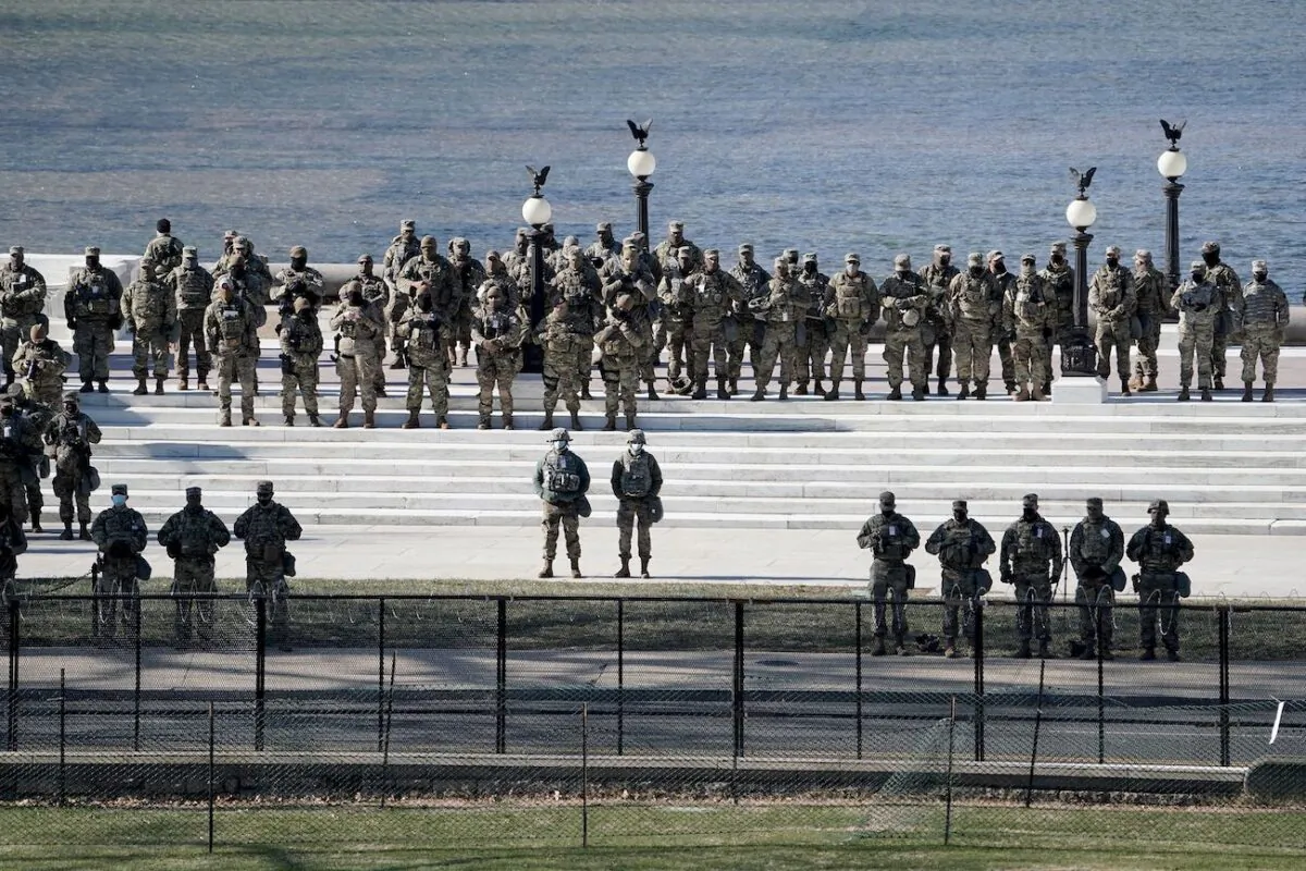 Members of the National Guard listen to President Joe Biden give his inaugural address during the 59th Presidential Inauguration at the U.S. Capitol in Washington on Jan. 20, 2021. (Greg Nash/AFP via Getty Images)