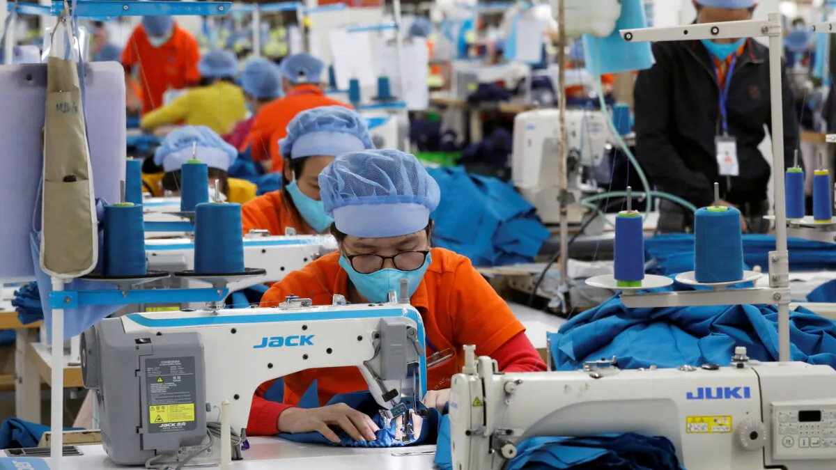 Laborers work at the Hung Viet garment export factory in Hung Yen Province, Vietnam, on Dec. 30, 2020. (Kham/Reuters)