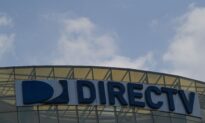 AT&T Takes $15.5 Billion Charge on DirecTV, Adds More Phone Customers