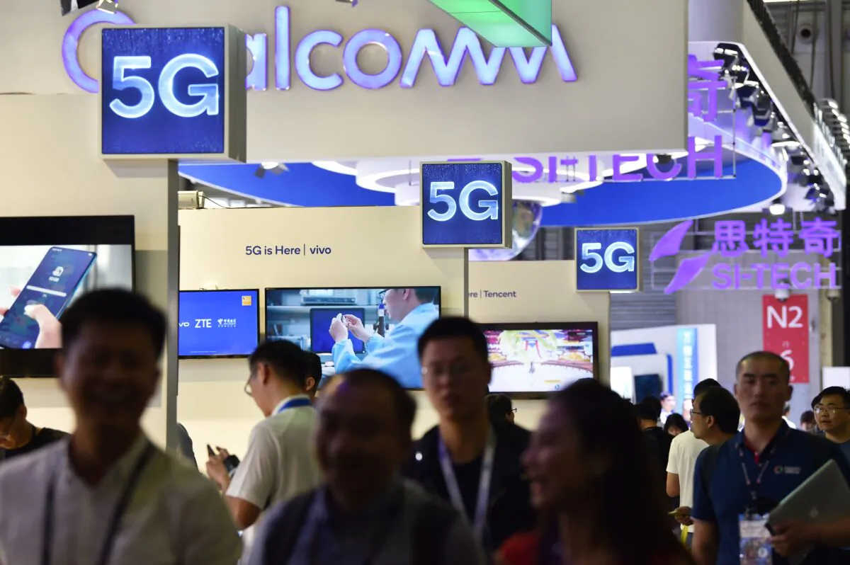 Logos of 5G providers at the Shanghai New International Expo Centre in Shanghai on June 27, 2019. (Hector Retamal/AFP via Getty Images)