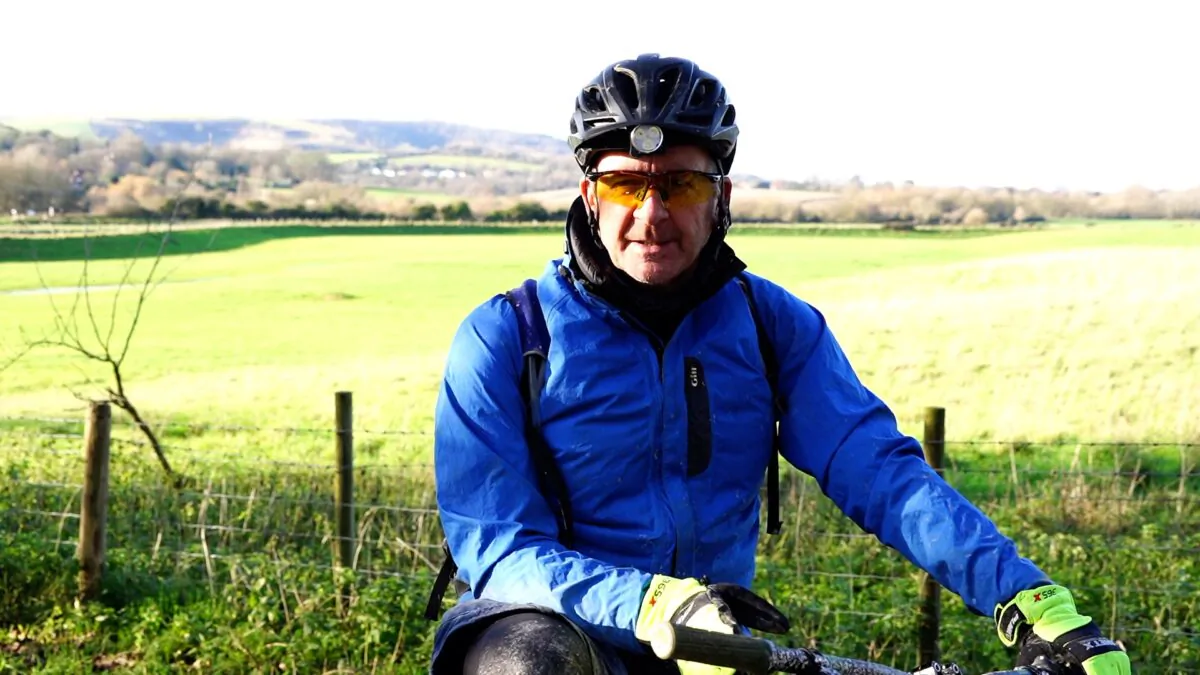 Laurence Penn, who survived 29 days in a coma with COVID-19, sits on his bike in Worthing, West Sussex on Jan. 22 2020. (NTD Television)