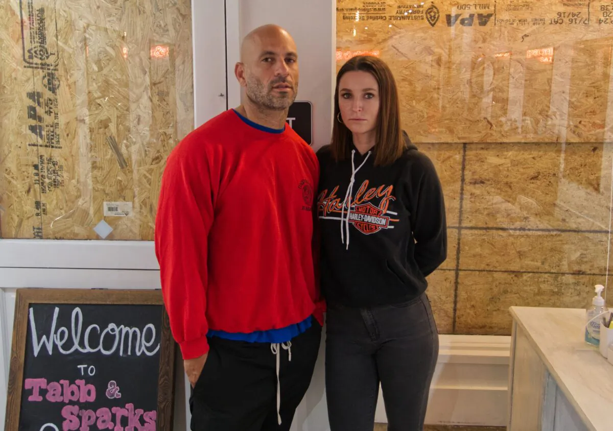 Michael Sparks and Kristina Tabb stand in their hair salon, Tabb & Sparks in Santa Monica, Los Angeles County, Calif., on Jan. 23, 2021. (William Sevilla)