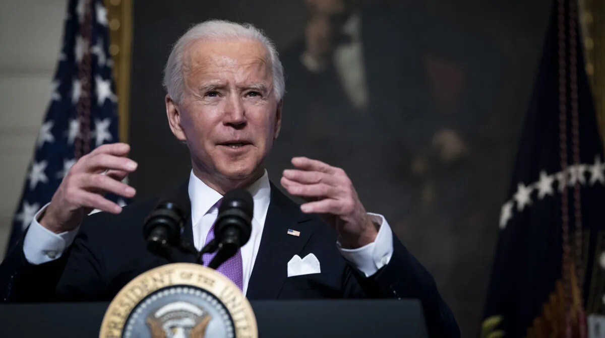 President Joe Biden speaks about the coronavirus pandemic in the State Dining Room of the White House in Washington on Jan. 26, 2021. (Doug Mills-Pool/Getty Images)
