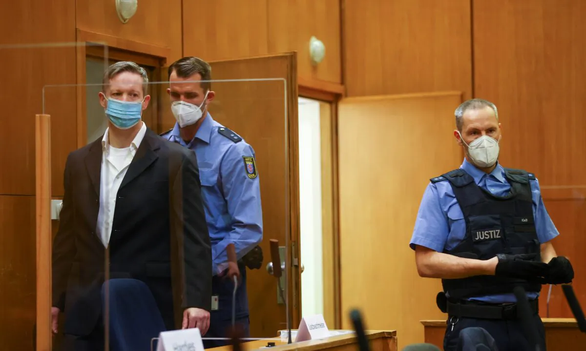 Main defendant Stephan Ernst arrives at the courtroom as he waits for the verdict in the case of the murder of Walter Luebcke, at the Higher Regional Court in Frankfurt, Germany, on Jan. 28, 2021. (Kai Pfaffenbach/Pool/Reuters)