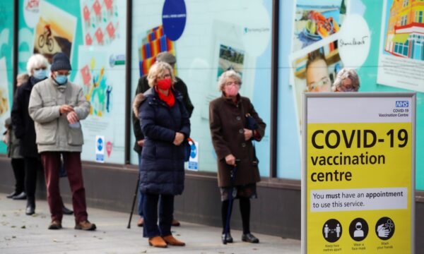 People queue to receive the coronavirus disease (COVID-19) vaccine